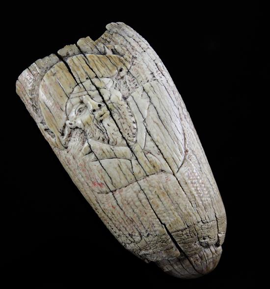 A 17th century carved whales tooth scrimshaw, 5.5in.